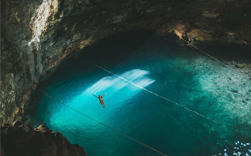 Mexican Cenote Girl swimming in a Mexican cenote