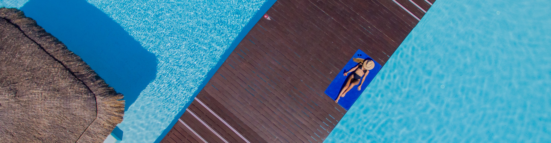 Woman at the pool of Privilege Aluxes Hotel