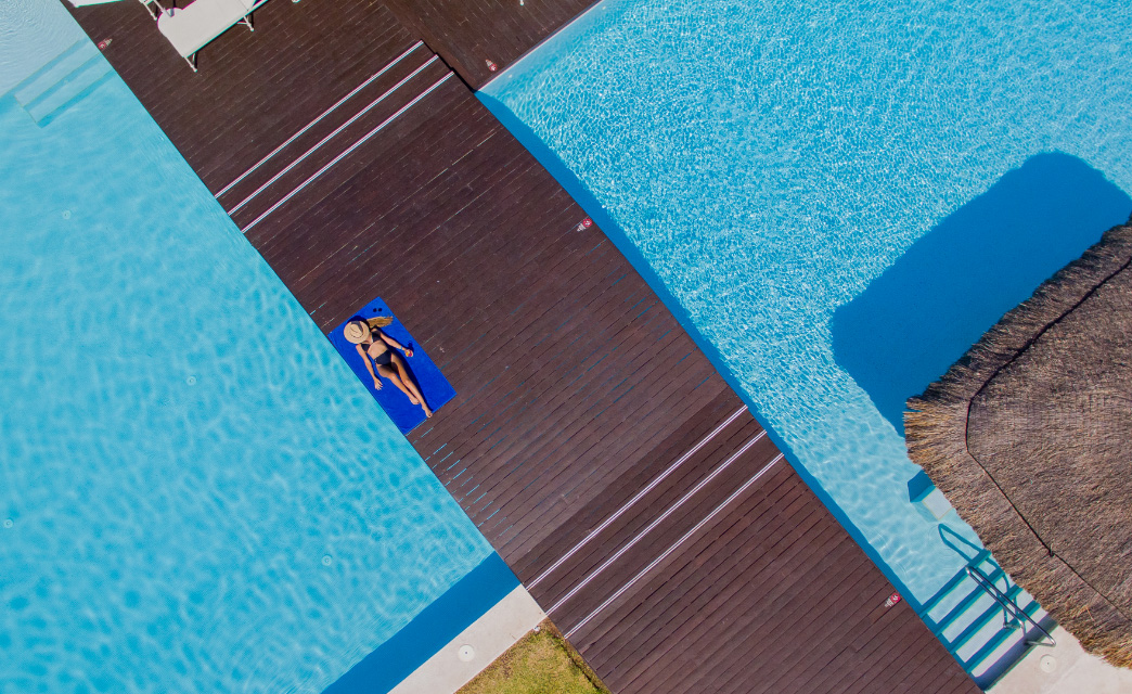 Woman at the pool of Privilege Aluxes Hotel