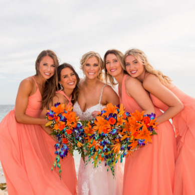 Bride and bridesmaids posing with their bouquet