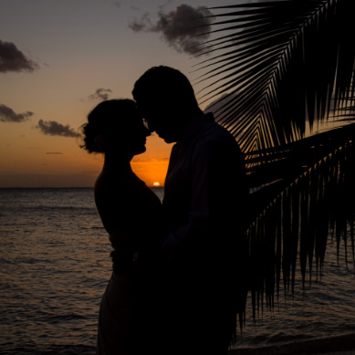Bride and groom photographed at sunset in Playa Norte