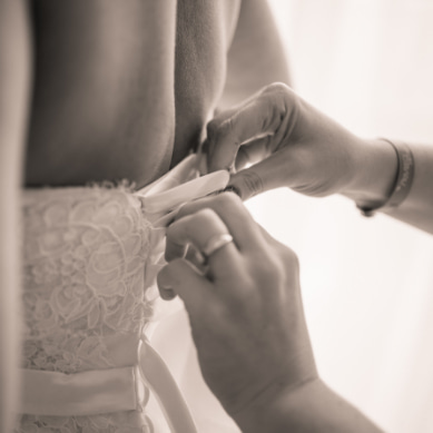 Black and white detail of a bride's wedding dress