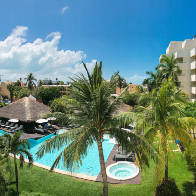 Pool area of the Privilege Aluxes Hotel