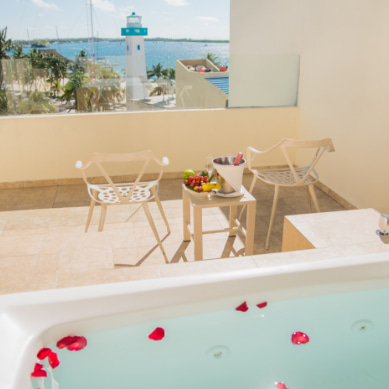 Champagne and rose petals on the terrace with Jacuzzi