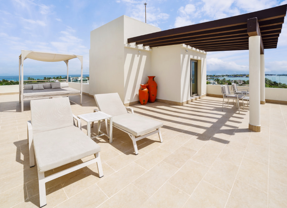 Rooftop terrace with hammocks and Balinese bed with ocean views