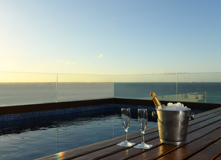 Champagne in the private pool of our Presidential Suite