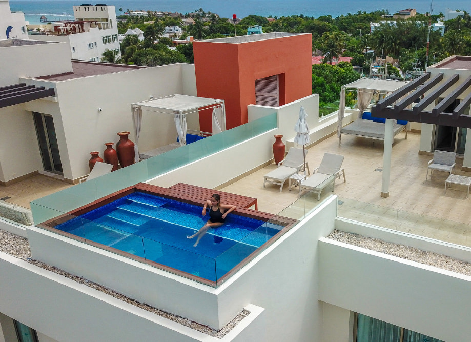 Woman relaxing in the Wow Privilege room's private pool.