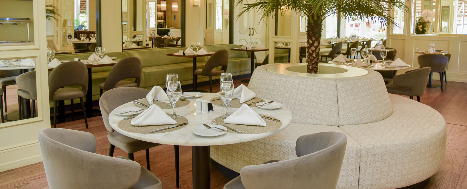 Tables and chairs in the dining room of Sabor restaurant