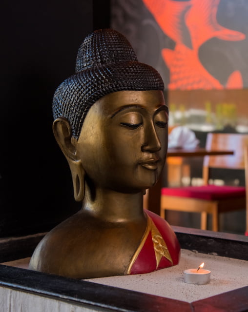 Loft with sculpture, candle and sand