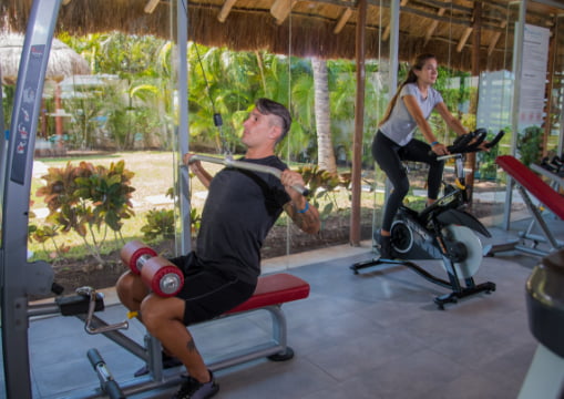 A client training in the gym of our resort