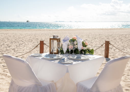 Table prepared for a romantic dinner on the sand of Playa Norte