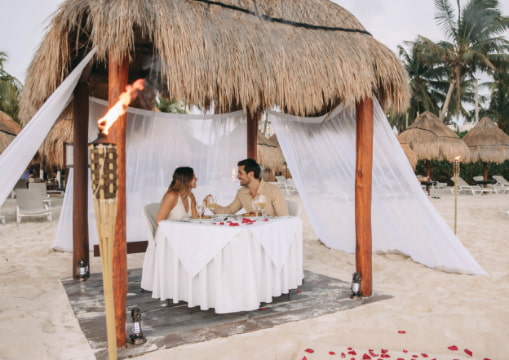 Table prepared for a romantic dinner on the sand of Playa Norte