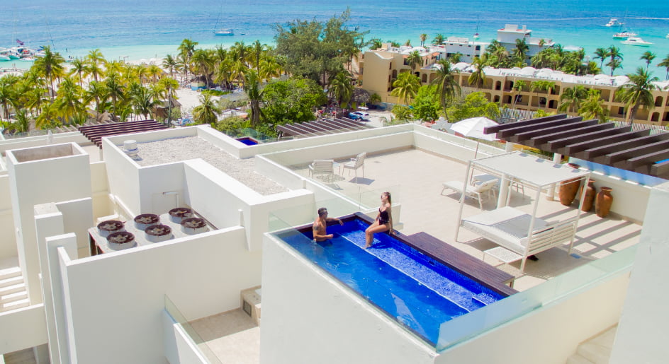 Couple enjoying the swimming pool on the terrace