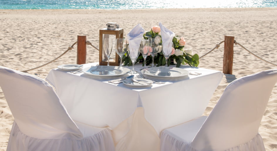 Dinner table on the beach sand