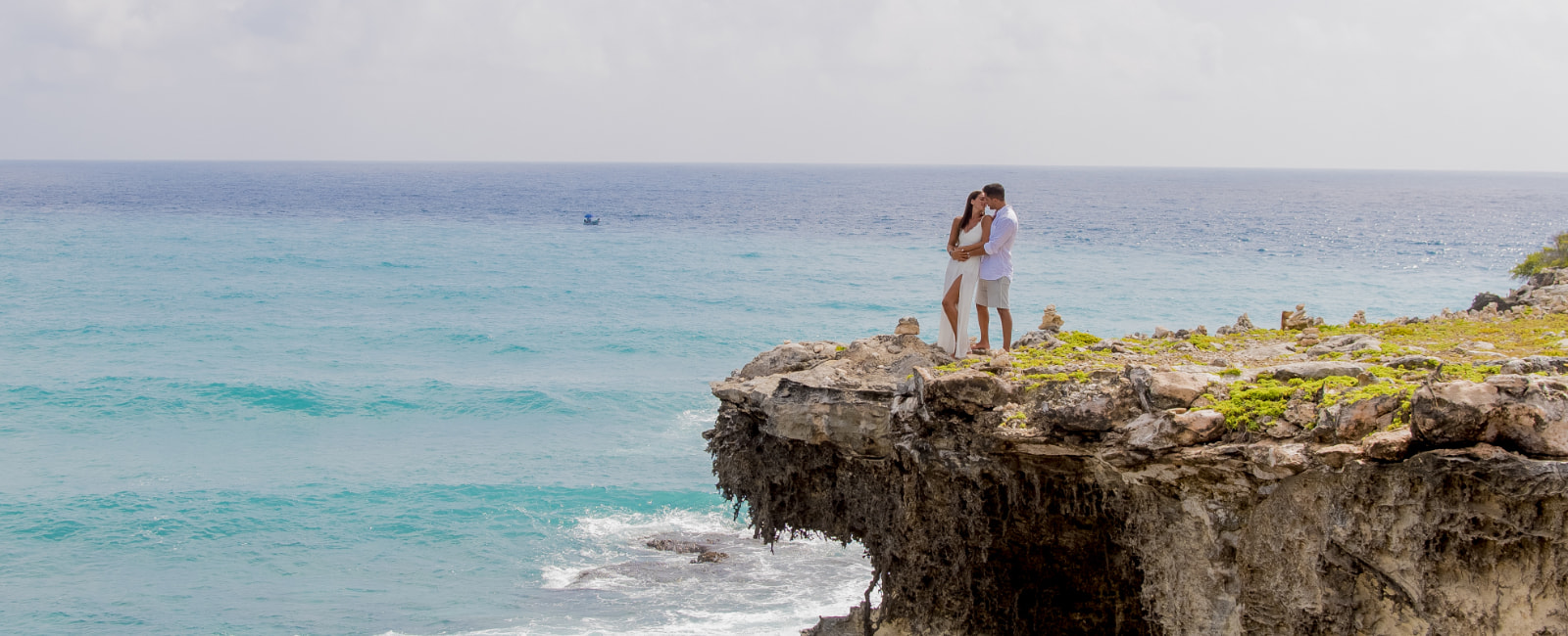 Couple kissing on the shore